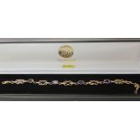 A 9ct gold and amethyst knot pattern bracelet to commemorate the Tercentenary of the Bank Of