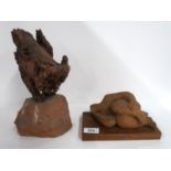 A stoneware sculpture of a figure lying down and another of an owl Condition Report: Available