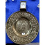 A Scottish brass celtic knotwork decorated charger together with a brass cased carriage clock