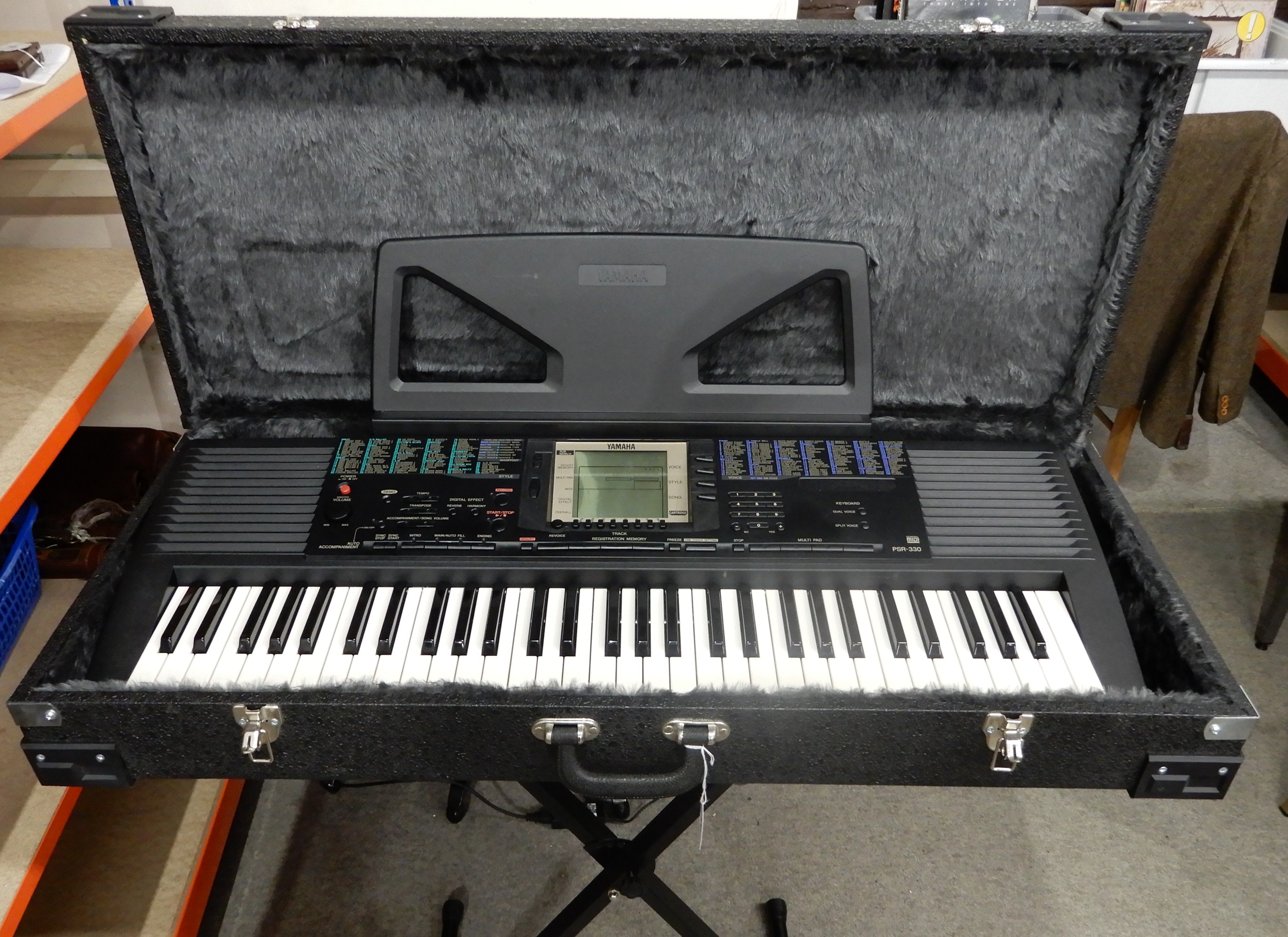 A Yamaha PSR-30 electric piano with fitted hard case and stand Condition Report: Available upon