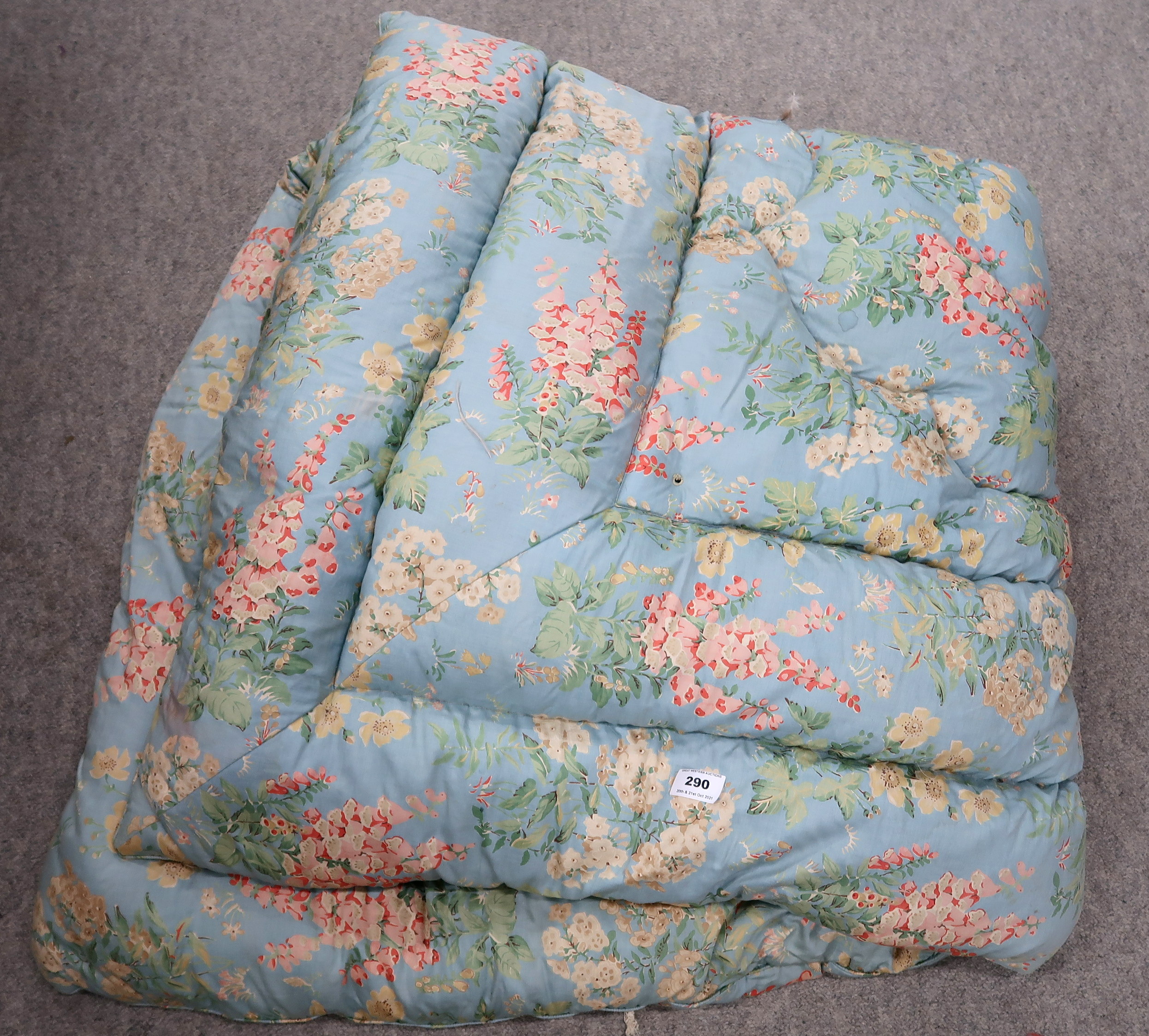 a quilted and feather filled floral blanket, approx 135 x 155 cm Condition Report: Not available for