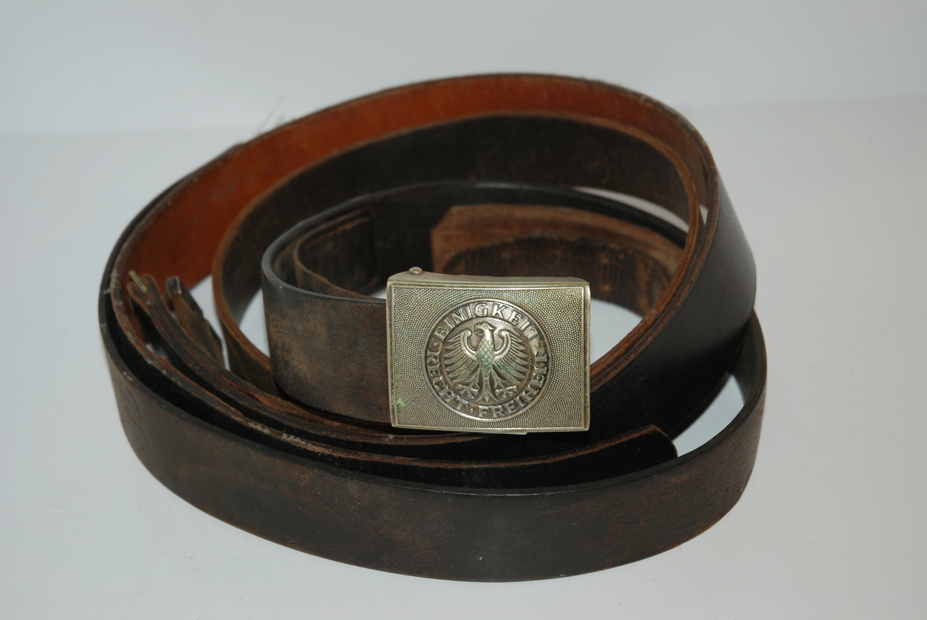 A 20th century helmet and leather belts Condition Report: Available upon request - Image 4 of 4