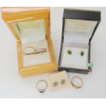 A 9ct gold illusion set diamond flower ring, size L1/2, wedding ring size L, emerald earrings etc,