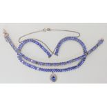 A silver mounted tanzanite necklace and bracelet set Condition Report: