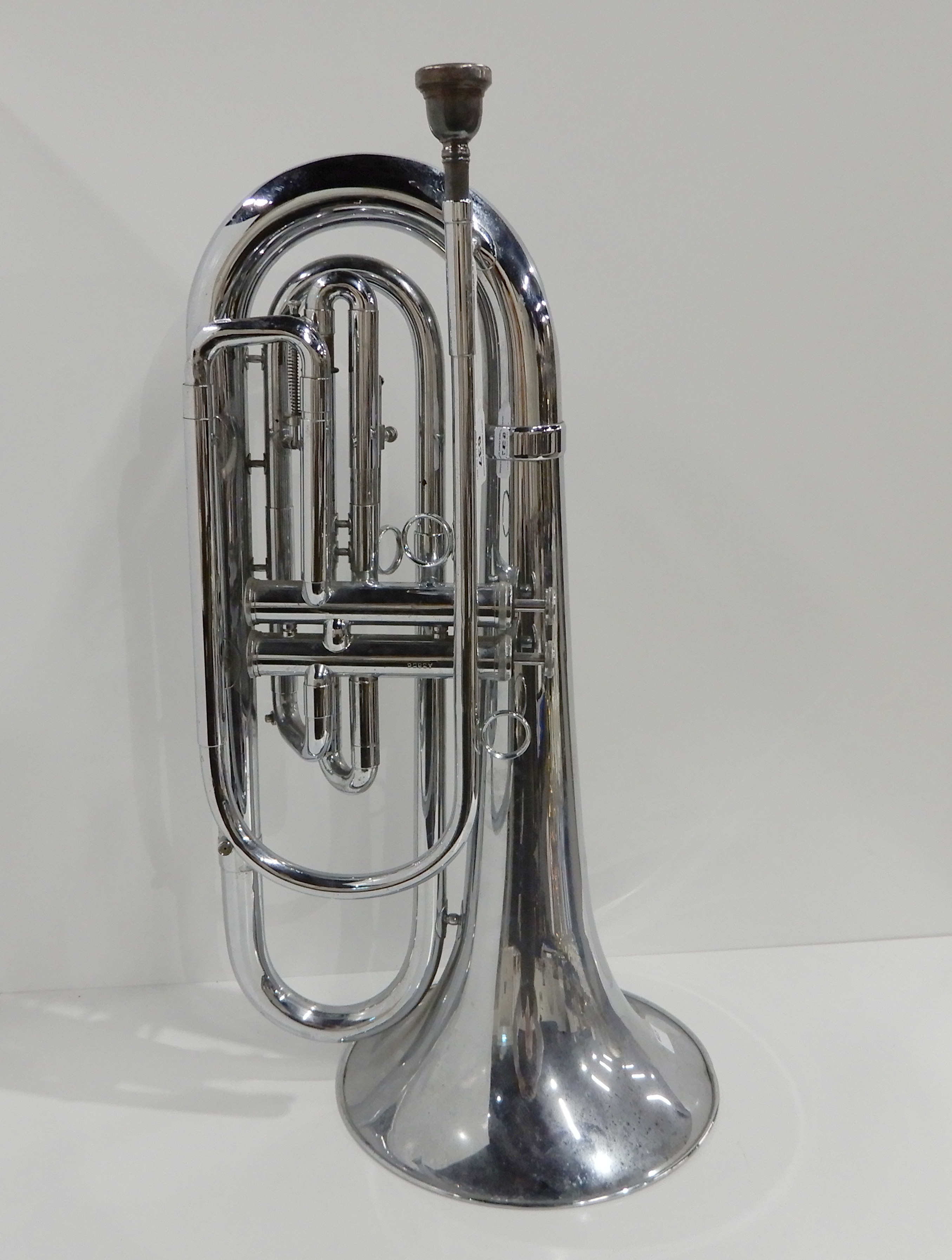 A two valve baritone bugle by Dynasty, A 3856, together with a Besson 8 mouthpiece Condition Report: