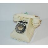 A vintage white Bakelite telephone Condition Report: Available upon request