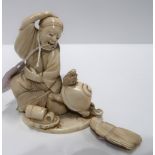 An ivory figure of a man and animal Condition Report: Available upon request