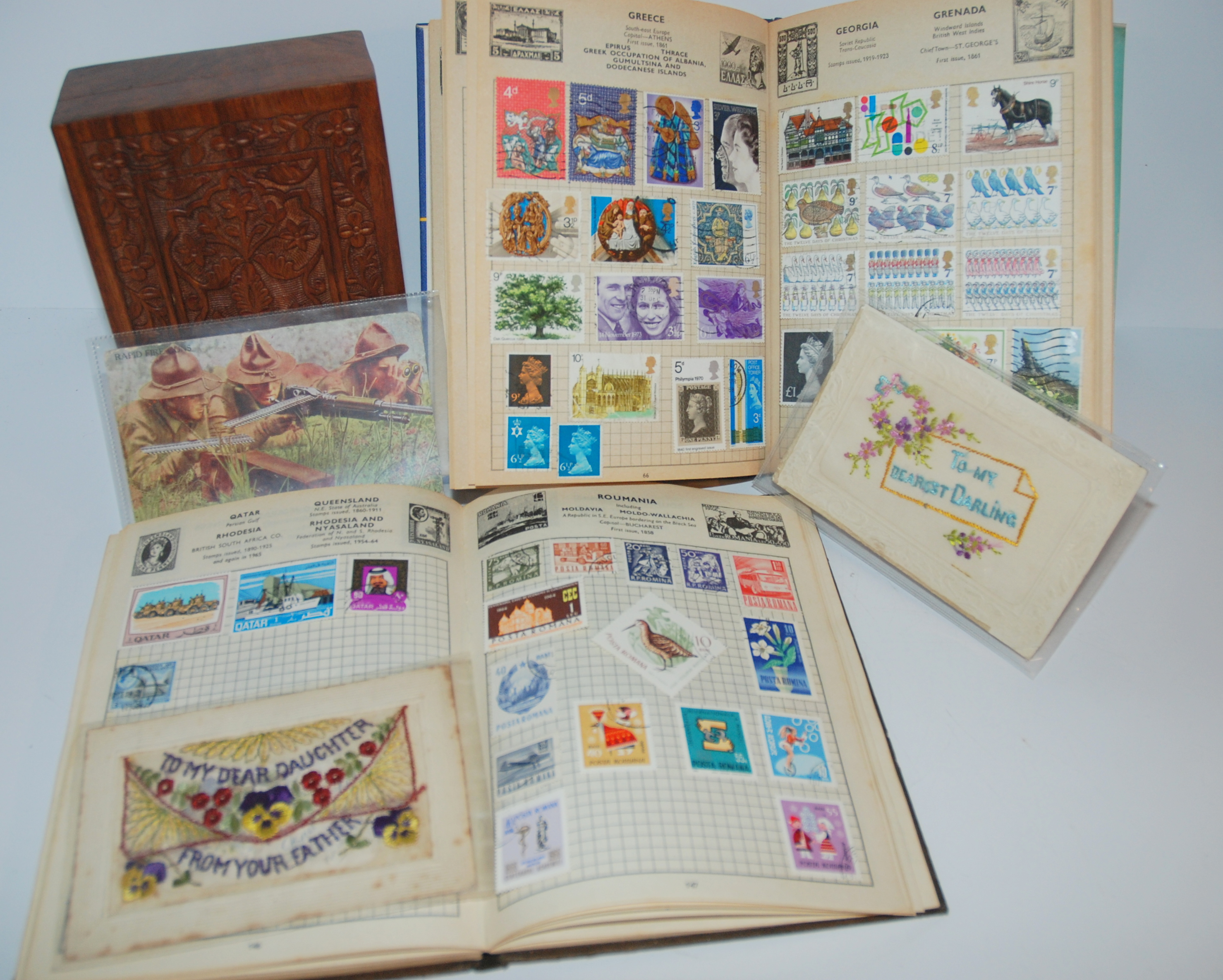 Two Improved stamp albums, two embroidered postcards and Rapid Fire Guns postcard Condition