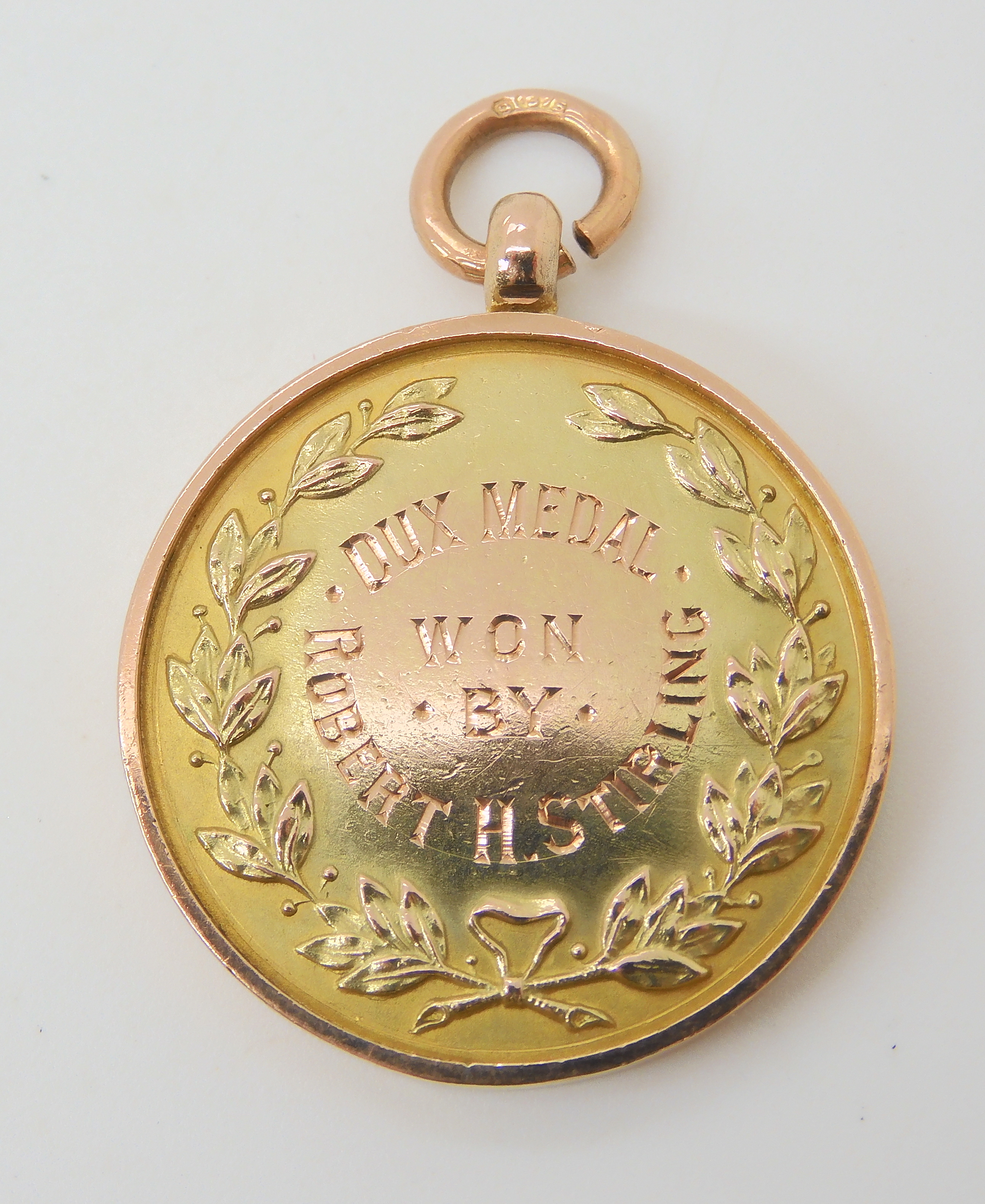 A 9ct gold Dux medal diameter 2.7cm, weight 11.5gms Condition Report: Available upon request