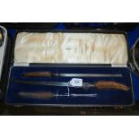 A cased three piece carving set Condition Report: Available upon request