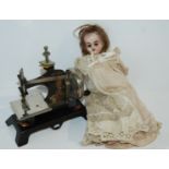 A tray lot including bisque-headed doll (def), child's sewing machine etc Condition Report: