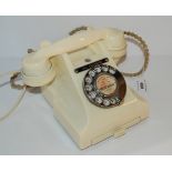 A vintage white Bakelite telephone Condition Report: Available upon request