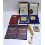 A lot comprising a 9ct gold masonic watch fob, two badminton medals Milan-Italy 1945 & 1946, a