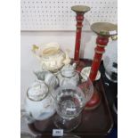 A pair of red ground wooden gilt painted candle sticks, a cut glass goblet, a Rockingham teapot, cup