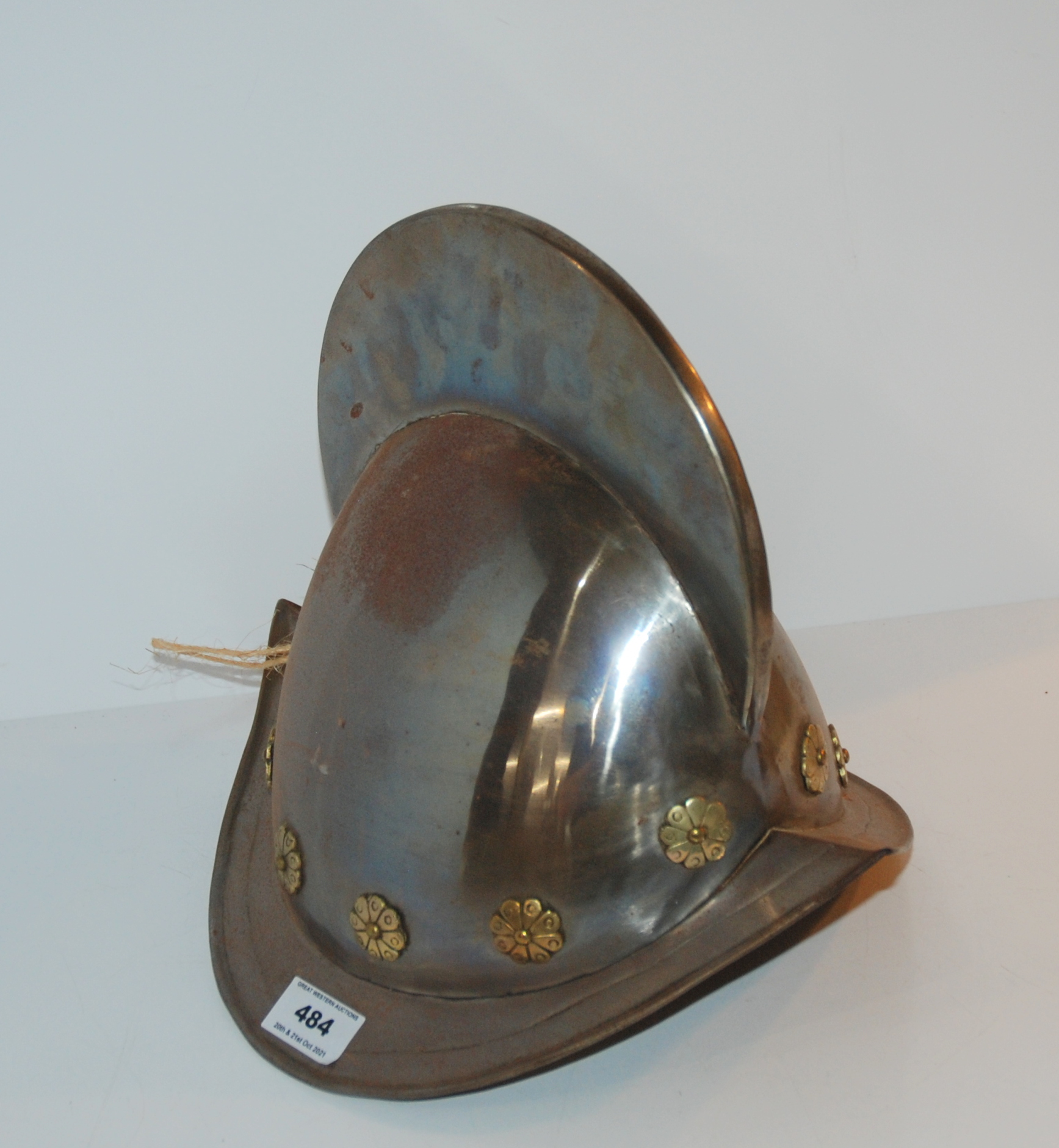 A 20th century helmet and leather belts Condition Report: Available upon request