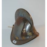 A 20th century helmet and leather belts Condition Report: Available upon request