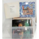 A box of rock and pop vinyl LP albums featuring The Rolling Stones, The Beatles, Slade, Jeff Beck,