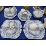 A Shelley teaset decorated with blue daisies and trailing foliage, pattern number 051/28, comprising