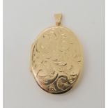 A 9ct gold engraved oval locket, dimensions 4.2cm x 2.5cm, weight 10.8gms Condition Report: