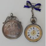 A silver Victorian Jubilee crown in mount and a silver fob watch Condition Report: Not available for