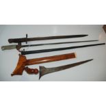 A bayonet stamped 1913, another bayonet with metal scabbard and a Kris (3) Condition Report: