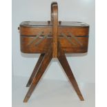 An oak free standing sewing box with concertina action, 44cm high Condition Report: Available upon