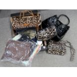 A collection of ladies handbags, clutch bags and scarves Condition Report: Not available for this