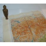 A West African figure metal fertility figure and a silk map (2) Condition Report: Available upon