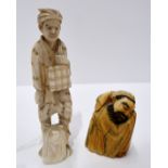 An ivory figure of a man and another of a sleeping man Condition Report: Available upon request