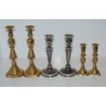 A pair EPNS candlesticks, 23cm high and two pairs of brass candlesticks, 28cm high and smaller and