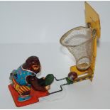 A Japanese tinplate basketball monkey Condition Report: Available upon request