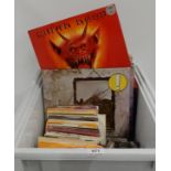 A box of vinyl LP rock records with Led Zepplin, Thunder, Uriah Heep, Bad Company,Free, Marillion,