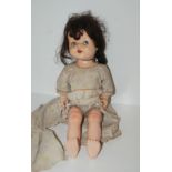 A vintage Pedigree doll, 50cm high Condition Report: Available upon request