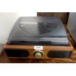 A small desk top vinyl record player with built in speakers Condition Report: Available upon