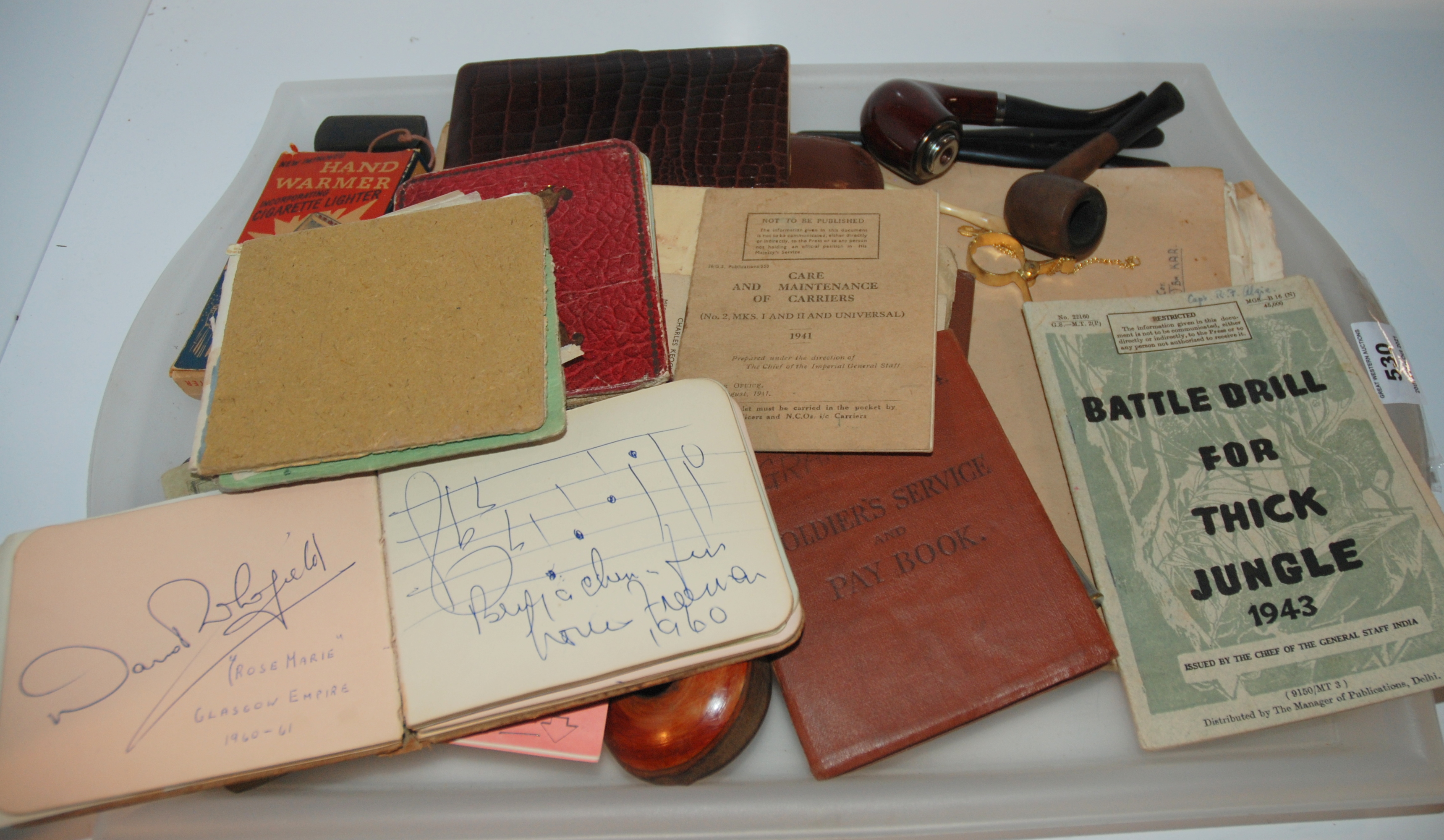 A tray lot of miscellaneous including autographs, pipes, cigarette cases, military booklets etc