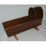 A vintage doll's cot, 45cm long and a vintage pram (2) Condition Report: Available upon request