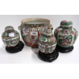 A pair of famille verte ginger jars, a larger example and a planter Condition Report: Available upon