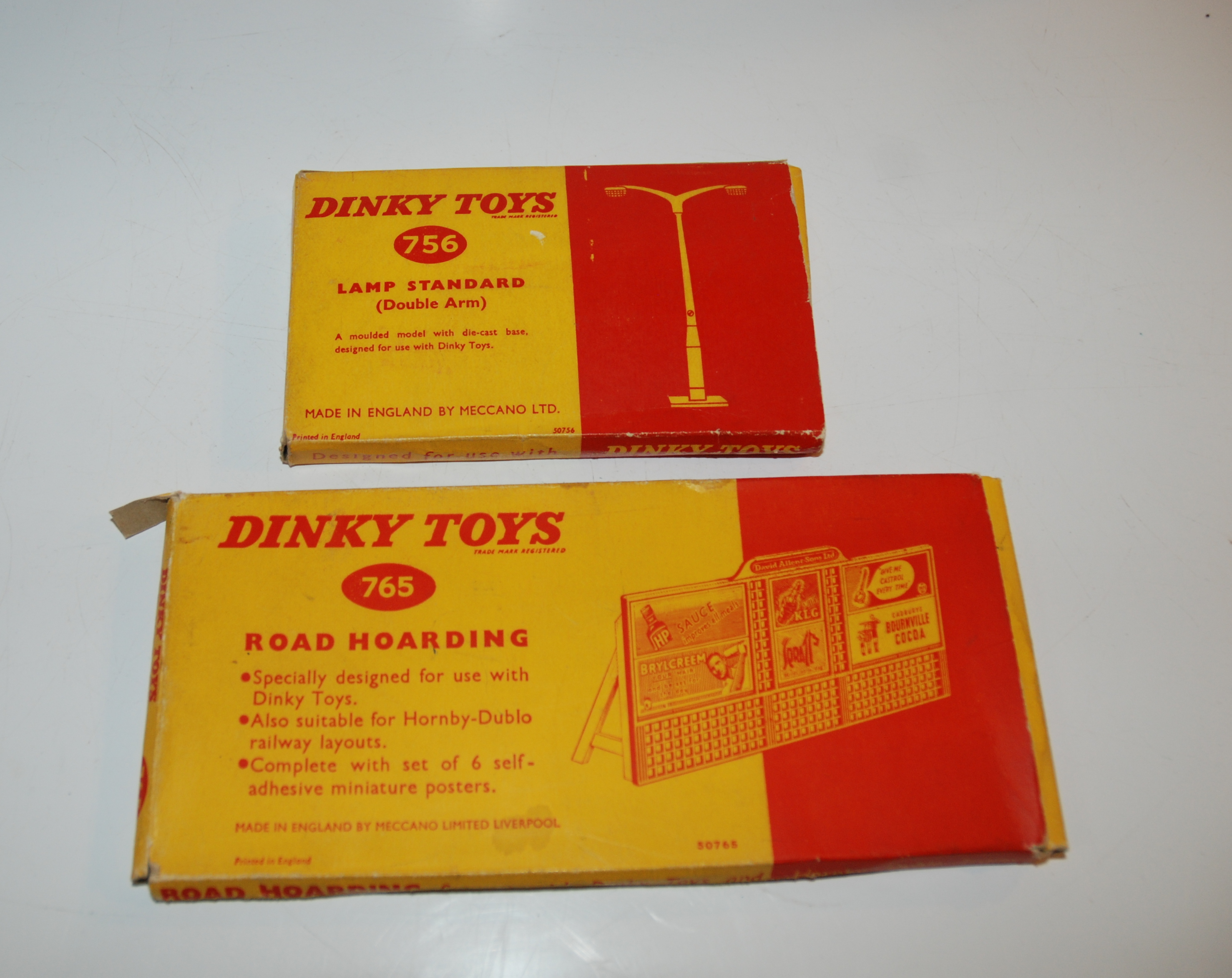 A Dinky Toys 765 Road Hoarding, 756 Lamp Standard and a box of various replica Dinky models