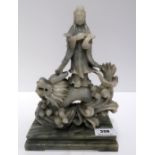 A carved soapstone figure of guanyin and a dragon Condition Report: Available upon request