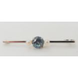 A 9ct white gold blue zircon and pearl bar brooch, weight 2.3gms Condition Report: Available upon