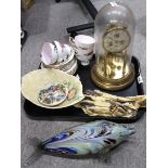 A glass dome mantle clock, a mottled glass model of a fish, Royal Standard floral decorated cups and