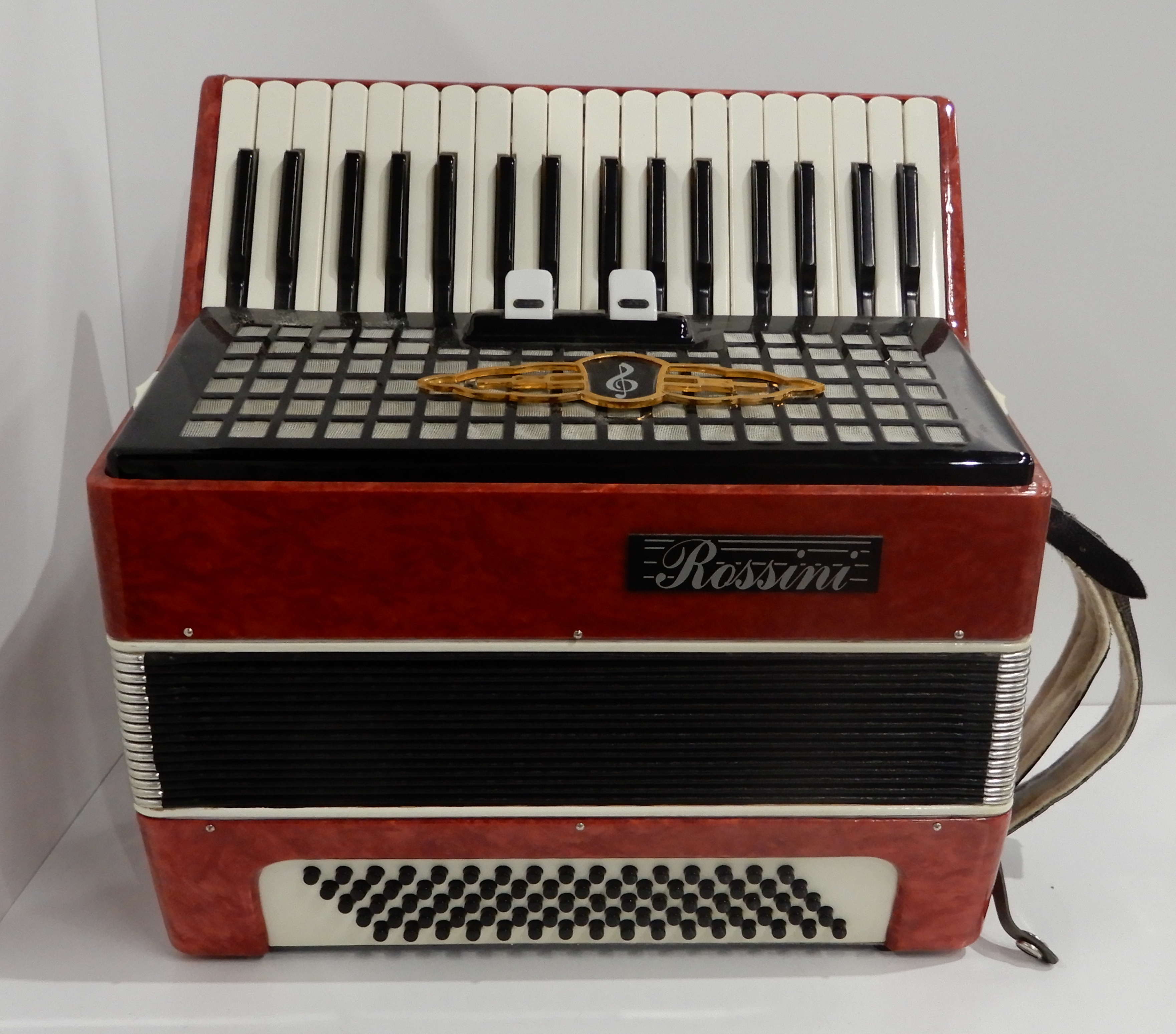 A Rossini Czechoslovakian accordion 34 key 80 bass with a case Condition Report: Available upon