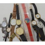 A yellow metal ladies vintage watch, a Swatch watch and other examples Condition Report: Not