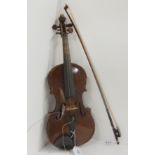 A two piece back violin 33 cm bearing makers mark Hopf below the nose together with a bow 51 grams