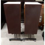 A pair of wood cabinet hi-fi stereo speakers on trolley stands (af) Condition Report: Available upon