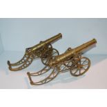 A pair of brass table cannons, 35cm long and three modern Danbury Mint war commemoratives