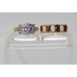 A 9ct gold opal and garnet ring, size O1/2, together with a pale blue gem and diamond ring (af) size