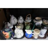 Assorted tea pots and pitchers, many with floral decoration, a Stuart Bass Exmoor pottery planter