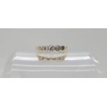 An 18ct gold and platinum, five stone diamond ring set with estimated approx 0.25cts of brilliant