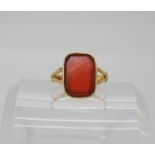 A yellow metal carnelian set signet ring, size approx N, weight 4gms Condition Report: Available